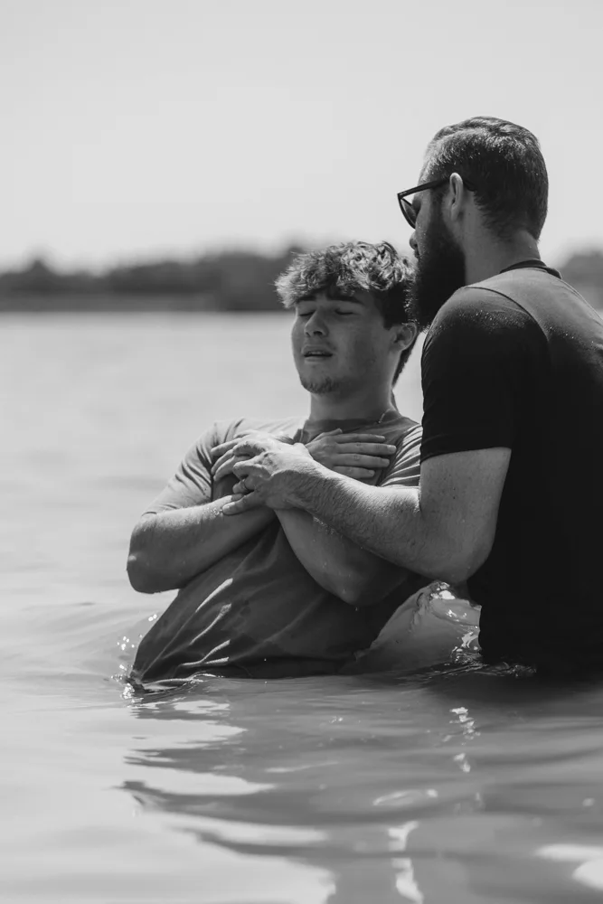 A young man getting baptized